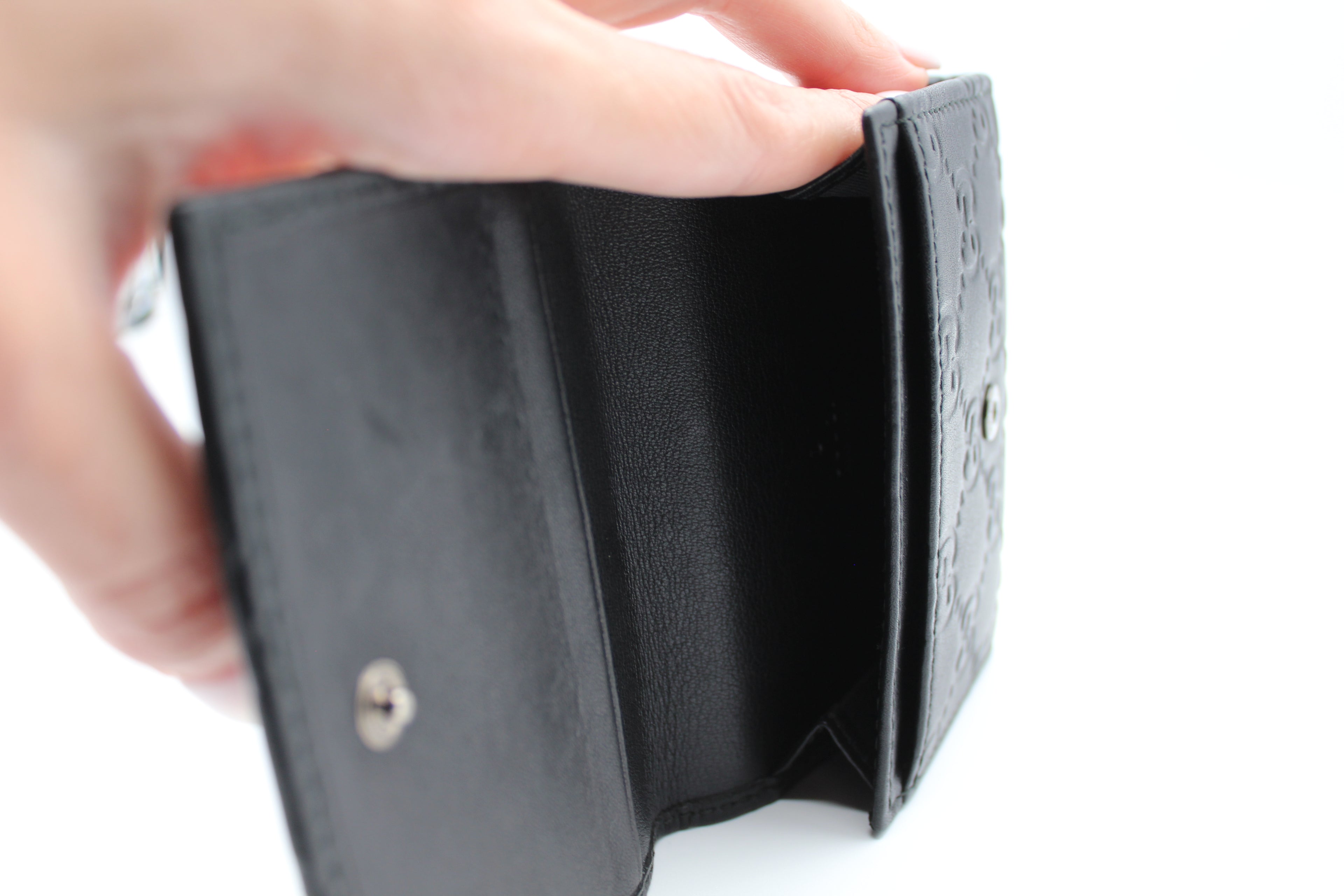 Gucci Guccissima Embossed Leather Compact Wallet — Black