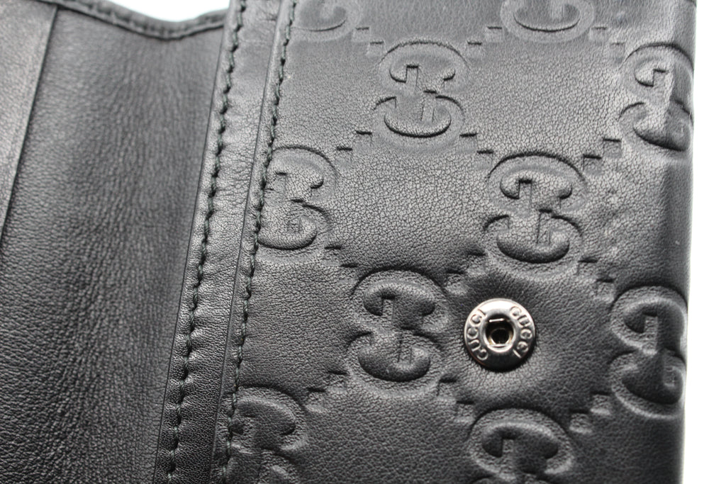 Gucci Guccissima Embossed Leather Compact Wallet — Black
